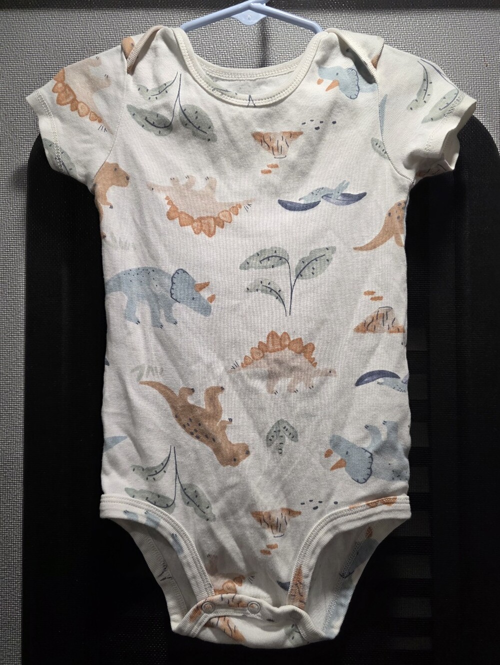 CARTERS Dinosaur Print Short-Sleeve Baby One-Piece in Cream and Blue